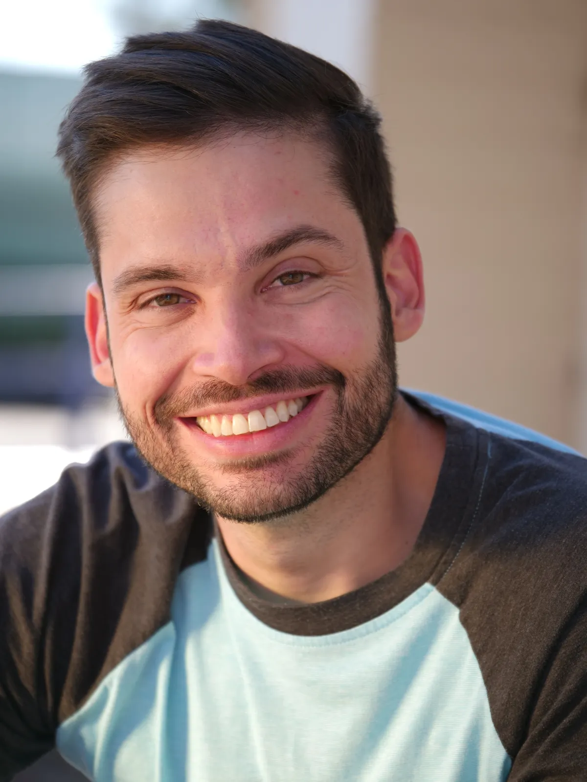 Smiling in a Baseball tee shirt